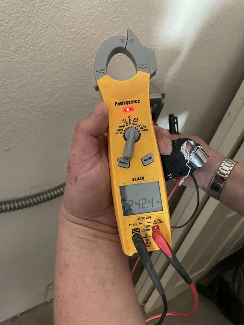 Voltage testing with clamp meter during Electrical Installation Services in Lawnside